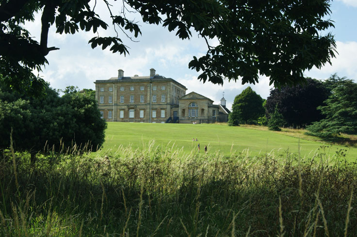 Cusworth Hall, with a hill below it and various people on the hill.